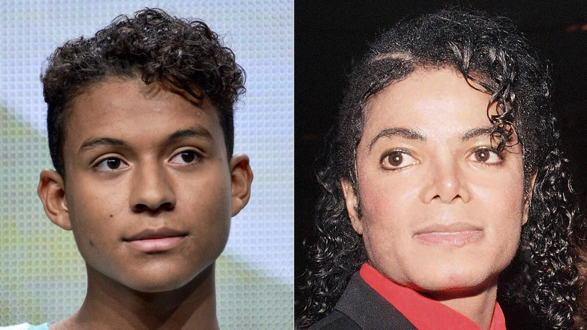 Jaafar Jackson appears during the 'Living with The Jacksons' panel at the Reelz Channel 2014 Summer TCA in Beverly Hills, California, on July 12, 2014, left, and Michael Jackson appears at the American Cinema Award gala in Beverly Hills, California, on Jan. 9, 1987. — AP file