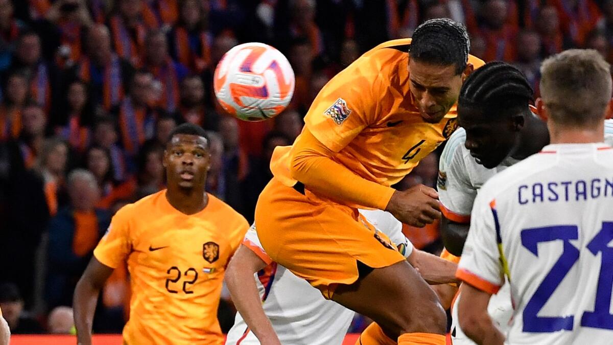 The Netherlands' defender Virgil van Dijk scores a goal against Belgium. (AFP)