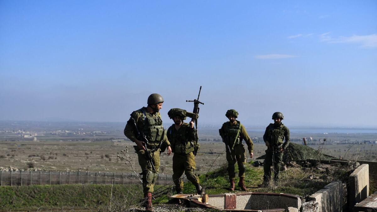 Israeli soldiers operate in the Israeli-occupied Golan Heights near the border with Syria. — Reuters