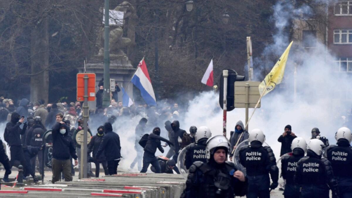 Police confront protestors during a demonstration against Covid-19 measures in Brussels. — AP