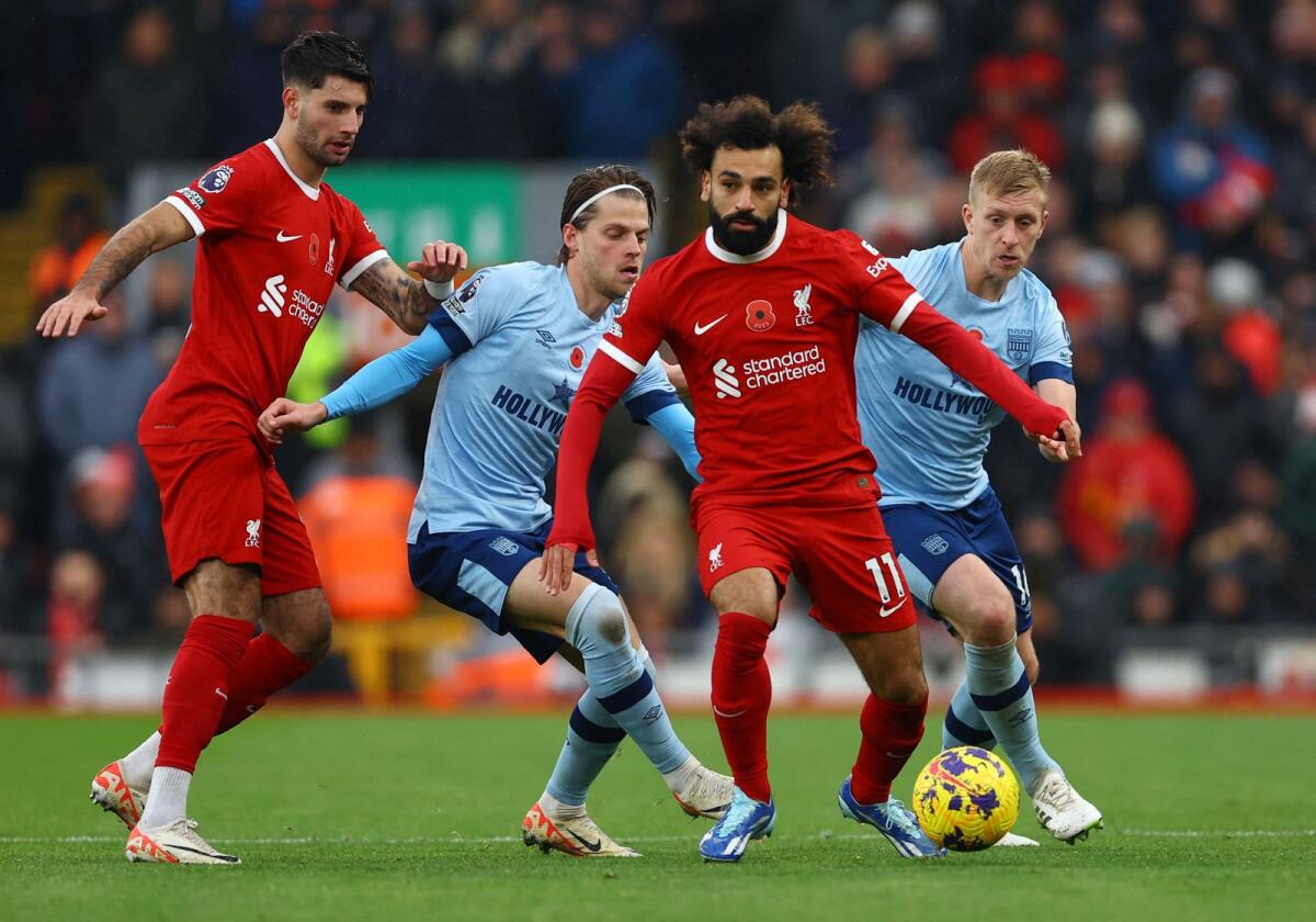 Liverpool's Mohamed Salah and Dominik Szoboszlai in action with Brentford's Mathias Jensen and Ben Mee.  - Reuters