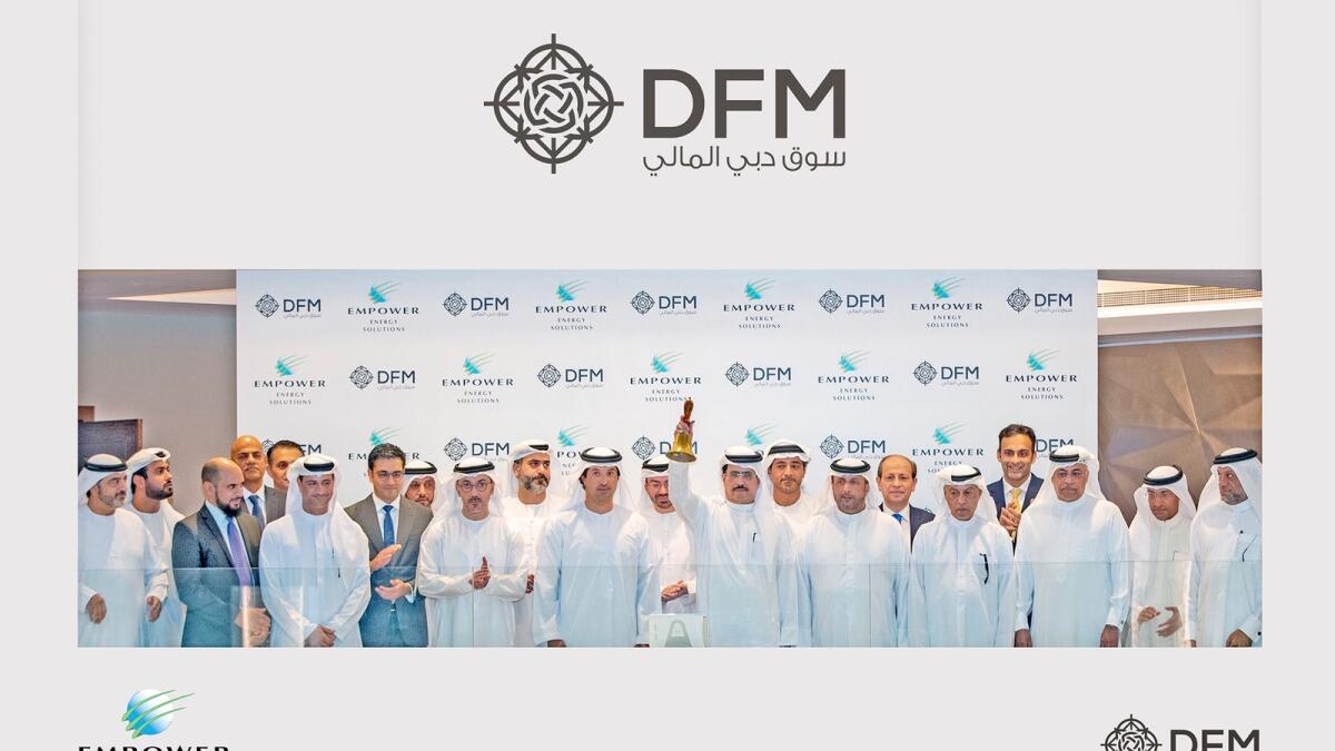 Saeed Mohammed Al Tayer, chairman of Empower, ringing the DFM market opening bell to celebrate the listing, in the presence of Helal Al Marri, chairman of the DFM; Ahmad bin Shafar, chief executive officer of Empower, and Hamed Ali, CEO of the DFM and Nasdaq Dubai. — Supplied photo