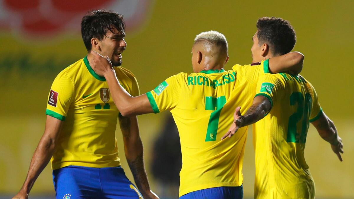 Brazil's Roberto Firmino (right) celebrates with teammates Lucas Paqueta (lrft) and Richarlison after scoring against Venezuela during their closed-door 2022 Fifa World Cup South American qualifier football match.— AFP
