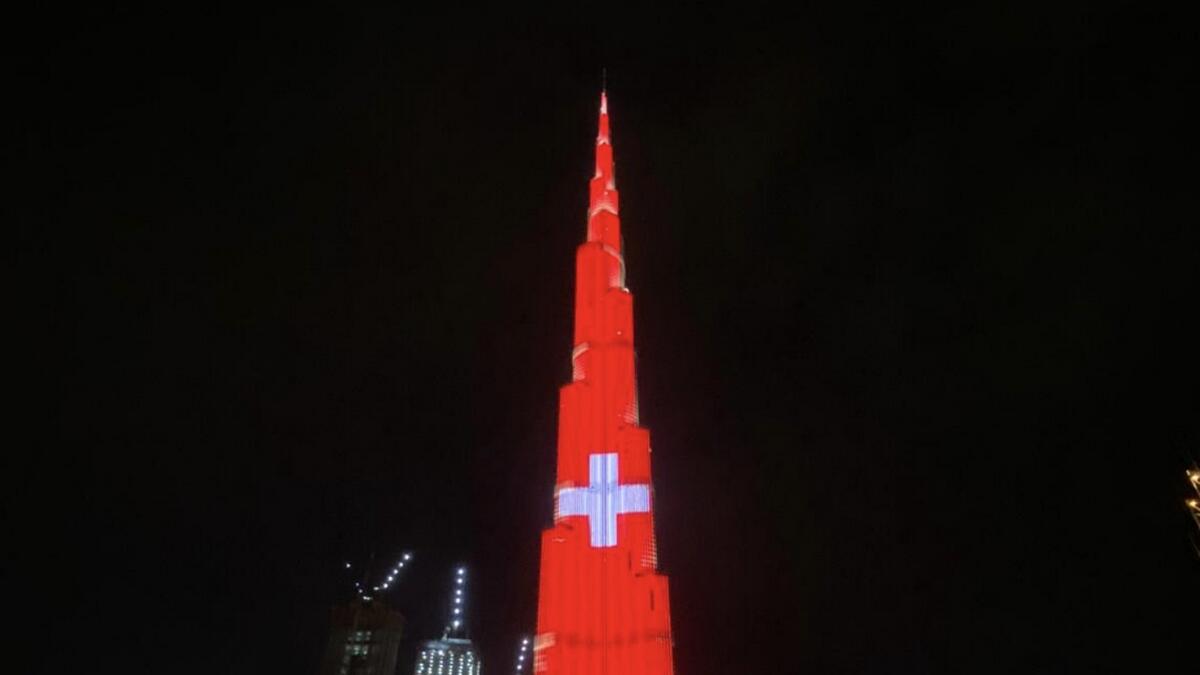 Combating, covid19, coronavirus, Dubai, Burj Khalifa, lights up, colours, Swiss flag
