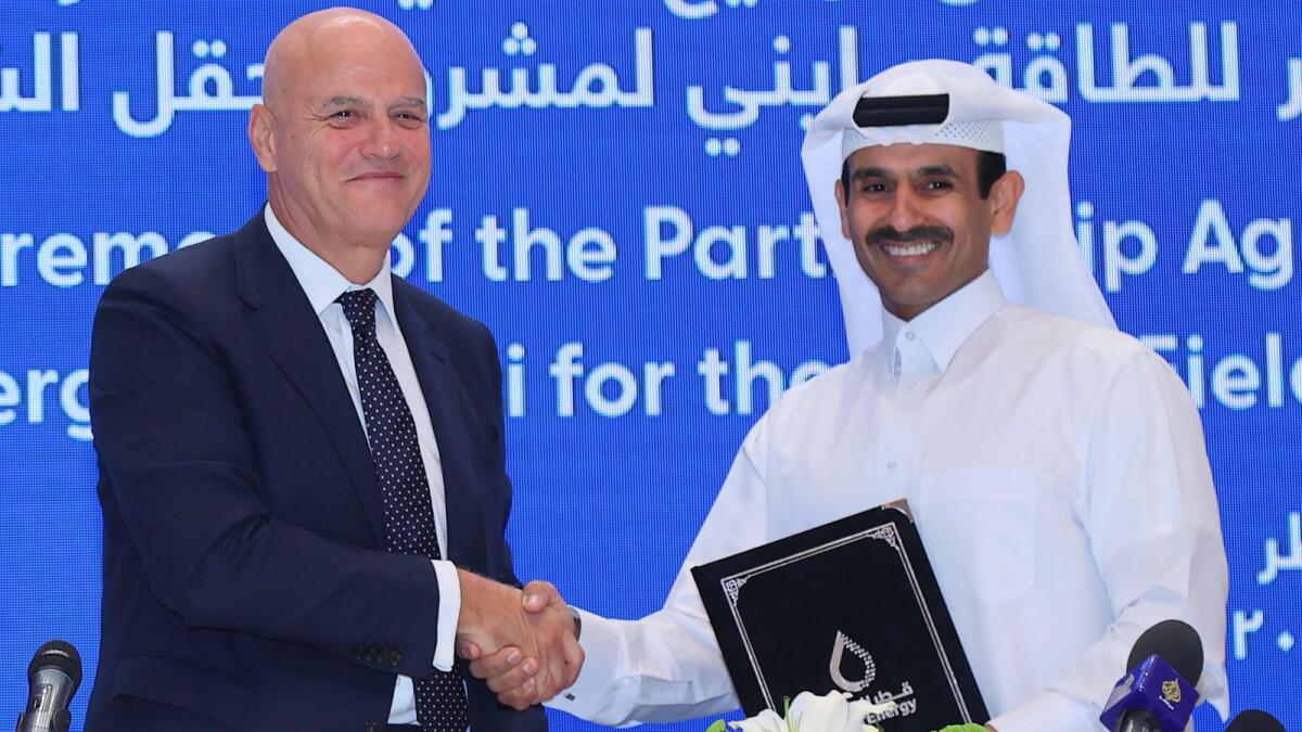 Qatar's Minister of State for Energy Affairs and President and CEO of QatarEnergy Saad Sherida Al Kaabi (right) shakes the hand of Claudio Descalzi, CEO of Italian multinational oil and gas company ENI, during a signing ceremony at the QatarEnergy headquarters in Doha on June 19, 2022. Italian company Eni joined Qatar Energy's project to expand production from the world's biggest natural gas field, days after Russia slashed supplies to Italy. — AFP photo