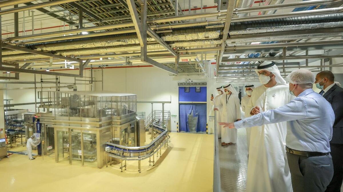 Dr Sultan bin Ahmed Al Jaber, Minister of Industry and Advanced Technology, visiting an industrial unit at the Khalifa Industrial City. — Supplied photo 
