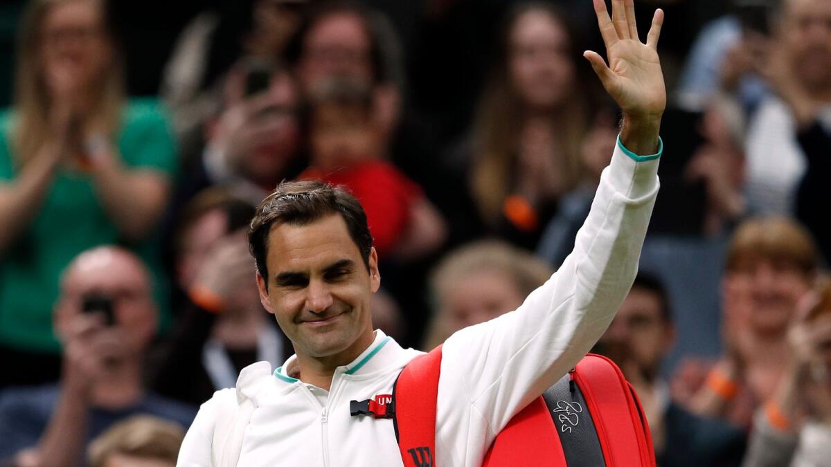 Switzerland's Roger Federer waves to the crowd after winning his first round match against France's Adrian Mannarino. (Reuters)
