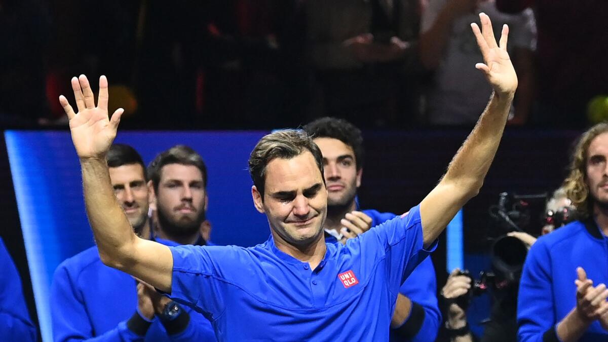 Roger Federer reacts after playing his final game, a doubles tie alongside Rafael Nadal, at the O2 Arena in London on Friday night. (AFP)