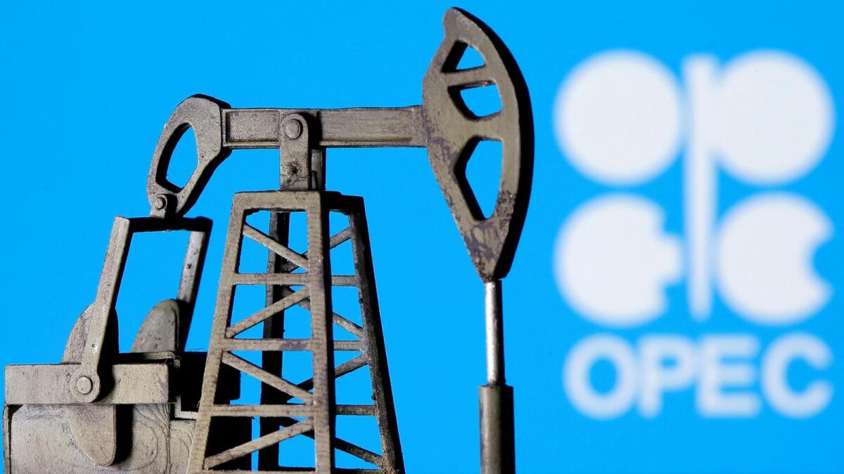 A 3D printed oil pump jack is displayed in front of Opec logo. — Reuters file