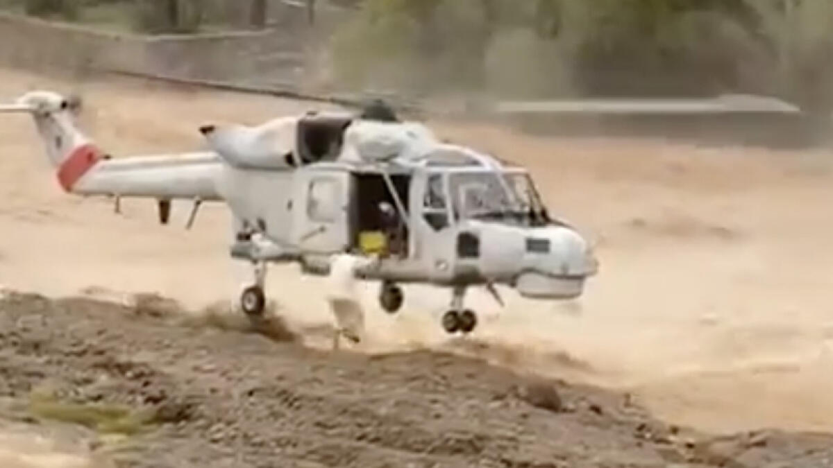 oman air force, rescue man, stranded, flooded wadi, heavy rains, oman rain, weather update, helicopter rescue