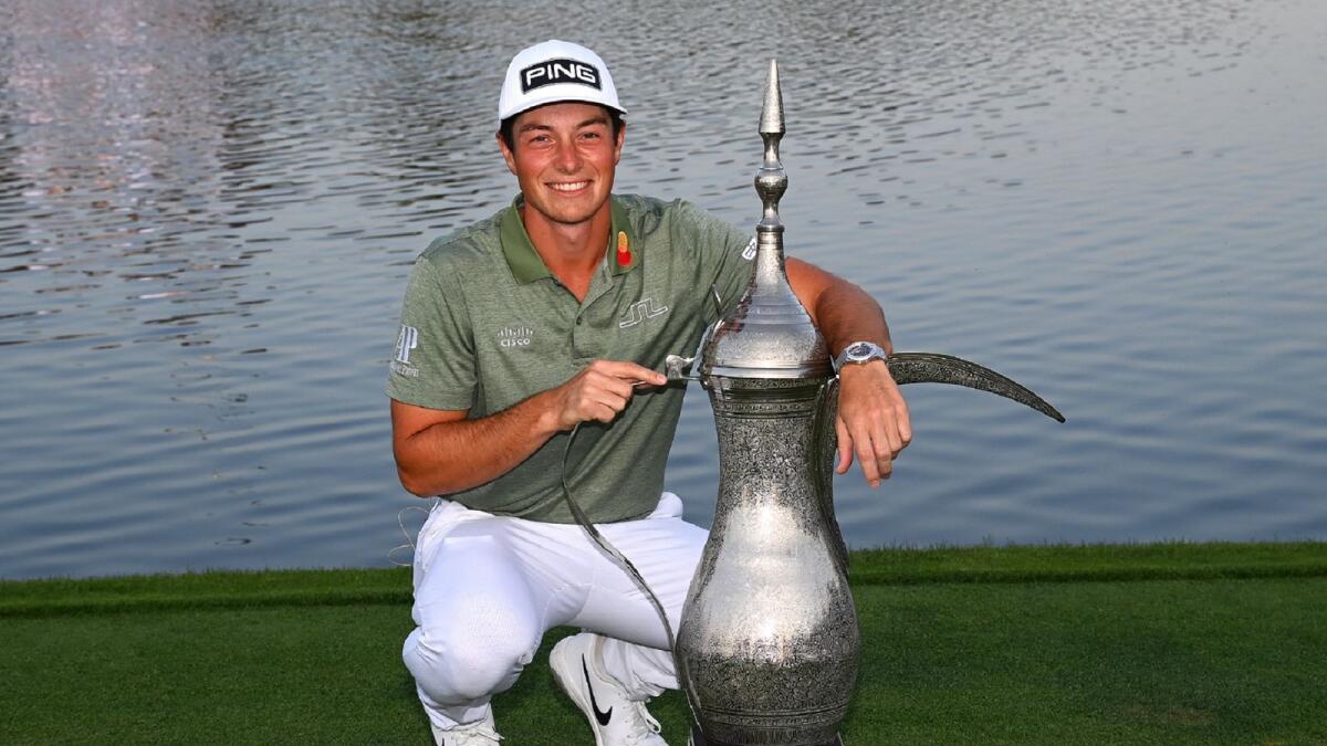 Viktor Hovland of Norway poses with the trophy after winning the Dubai Desert Classic at the Emirates Golf Club on Sunday. (Picture courtesy Dubai Desert Classic)