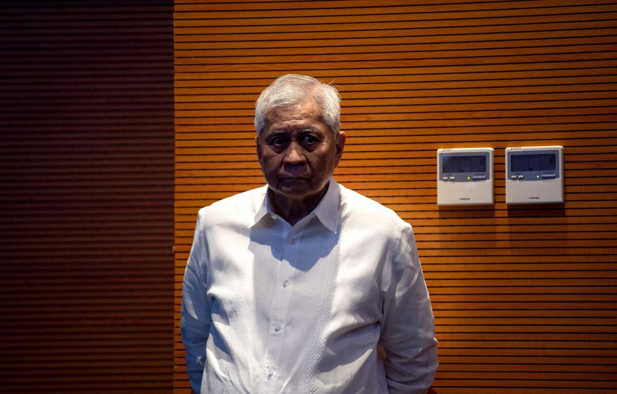 Former foreign affairs secretary Albert del Rosario attends a forum in Manila.  — AFP file