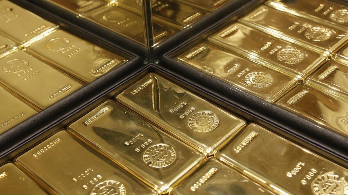 Gold bars are displayed at a store.