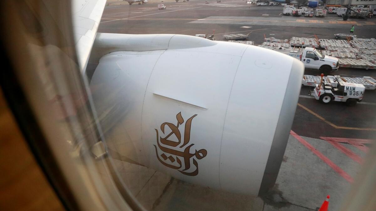 The Emirates logo is seen on the Emirates Boeing 777-200LR plane following its arrival at Mexico City International Airport.