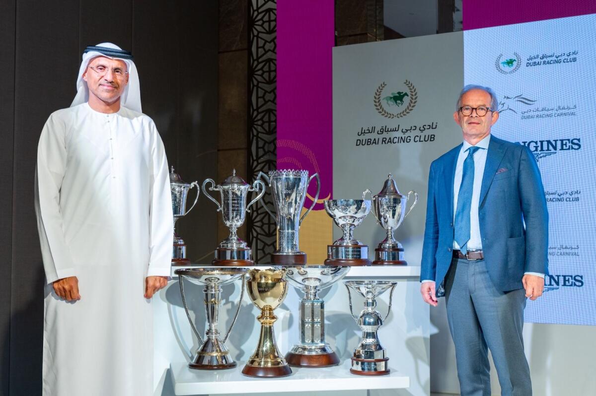 Major General Dr. Mohammed Essa Al Adhab, Board Member and Executive Director of Dubai Racing Club, and Erwan Charpy, Racing Advisor, Dubai Racing Club, with the nine trophies which will be presented to the winners on Fashion Friday. — KT photo by Shihab