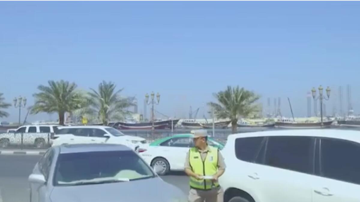 Woman parks car for free using Dubai RTA officers ID 