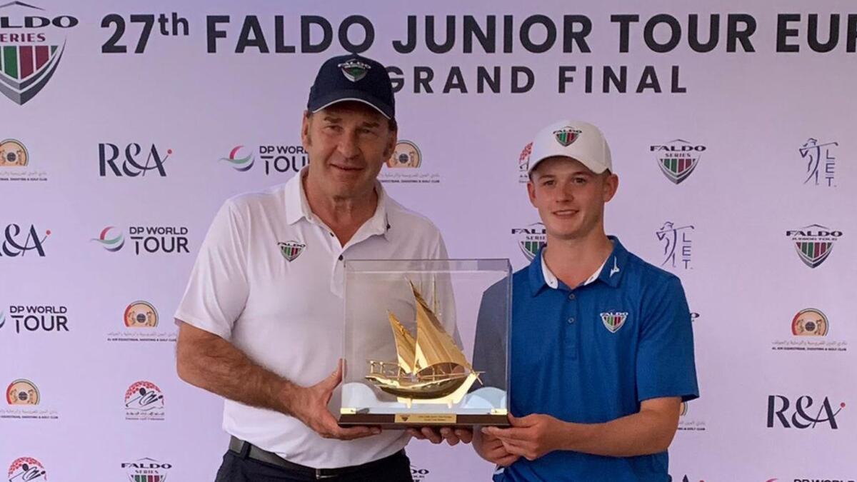 Sir Nick Faldo (L) presenting the overall prize of the Faldo Junior Tour Europe Grand Final to England's Ben Bolton. - Supplied photo