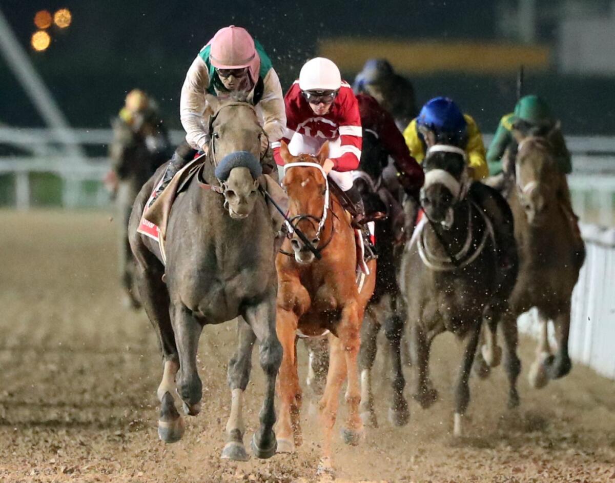 Jockey Mike Smith (left) rides Arrogate to victory in the Dubai World Cup on March 25 in 2017. — AFP file