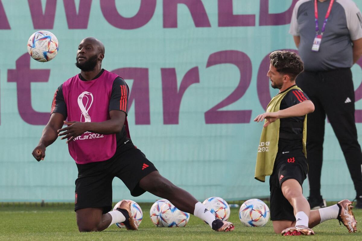 Belgium's Romelu Lukaku (left) and Dries Mertens take part in a training session at the Salwa Training Site on Wednesday. — AFP