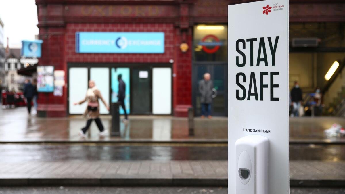 A hand sanitiser dispenser for combating the spread of the Covid-19 virus is pictured on Oxford Street in London. – AFP