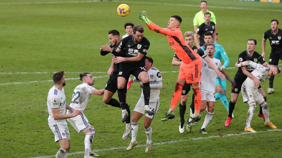 Leeds United's French goalkeeper Illan Meslier punches the ball clear during the English Premier League  match against Burnley. — AFP