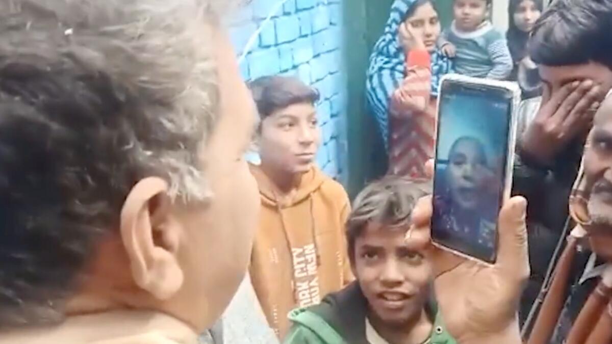 In a screengrab from a video shared by Times of India, Munni's family members talk to her on a video call. — Courtesy: Twitter