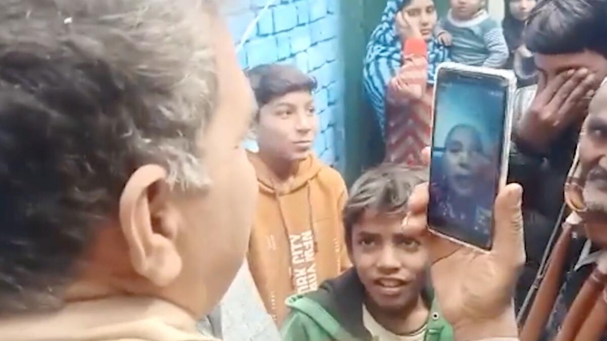 In a screengrab from a video shared by Times of India, Munni's family members talk to her on a video call. — Courtesy: Twitter