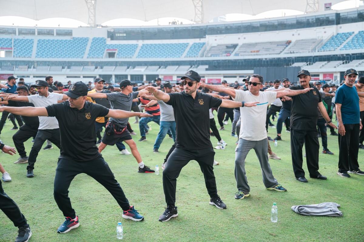Ibrahim Galadari, Group Chief Investment Officer, Ravi Tharoor, Chief Executive Officer - Media Division, Advertising among other employees participate in the opening of Galadari Fitness Challenge 2023 at Dubai International Cricket Stadium on Saturday. Photo by Neeraj Murali