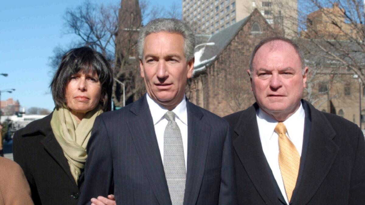 Charles B. Kushner, flanked by his wife Seryl Beth and his attorney arrives at the Newark Federal Court for sentencing in 2005.— AP file