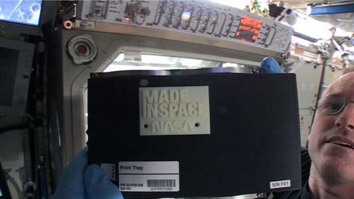 Space station’s 3-D printer pops out first creation