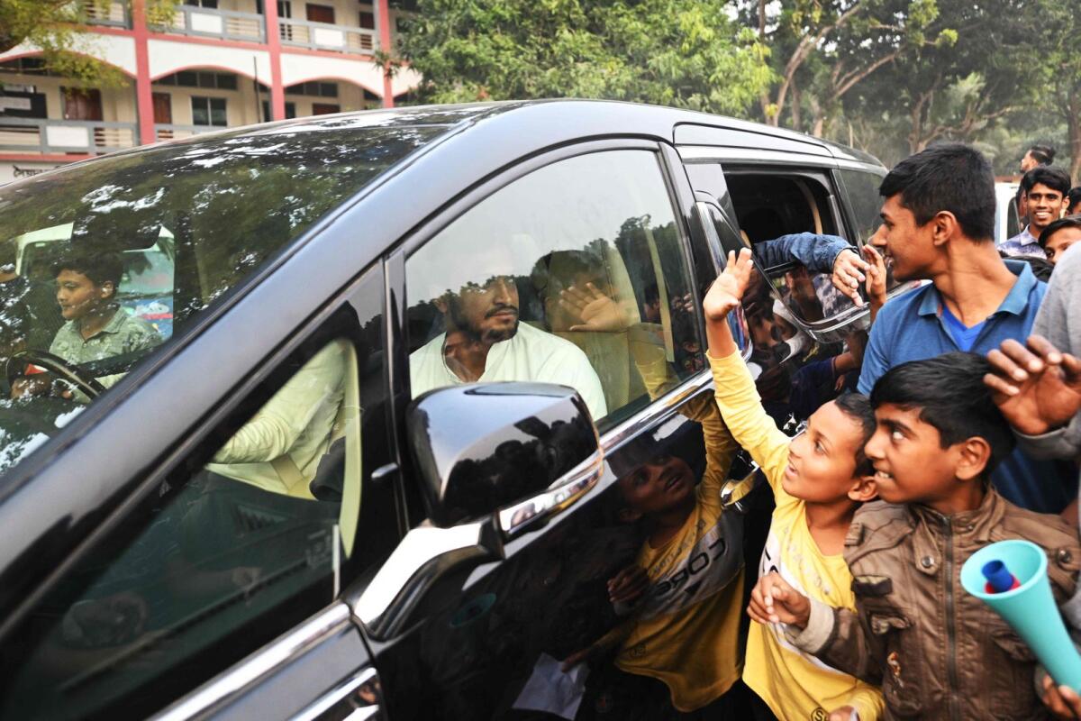Shakib Al Hasan leaves on a car after a campaign rally ahead of the 2024 general elections in Magura. — AFP