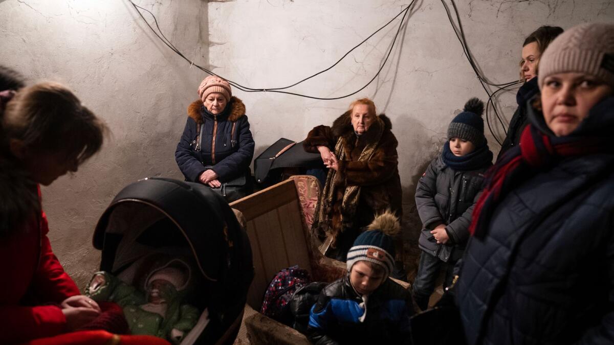 People hide in a shelter during Russian shelling, in Mariupol, Ukraine. – AP