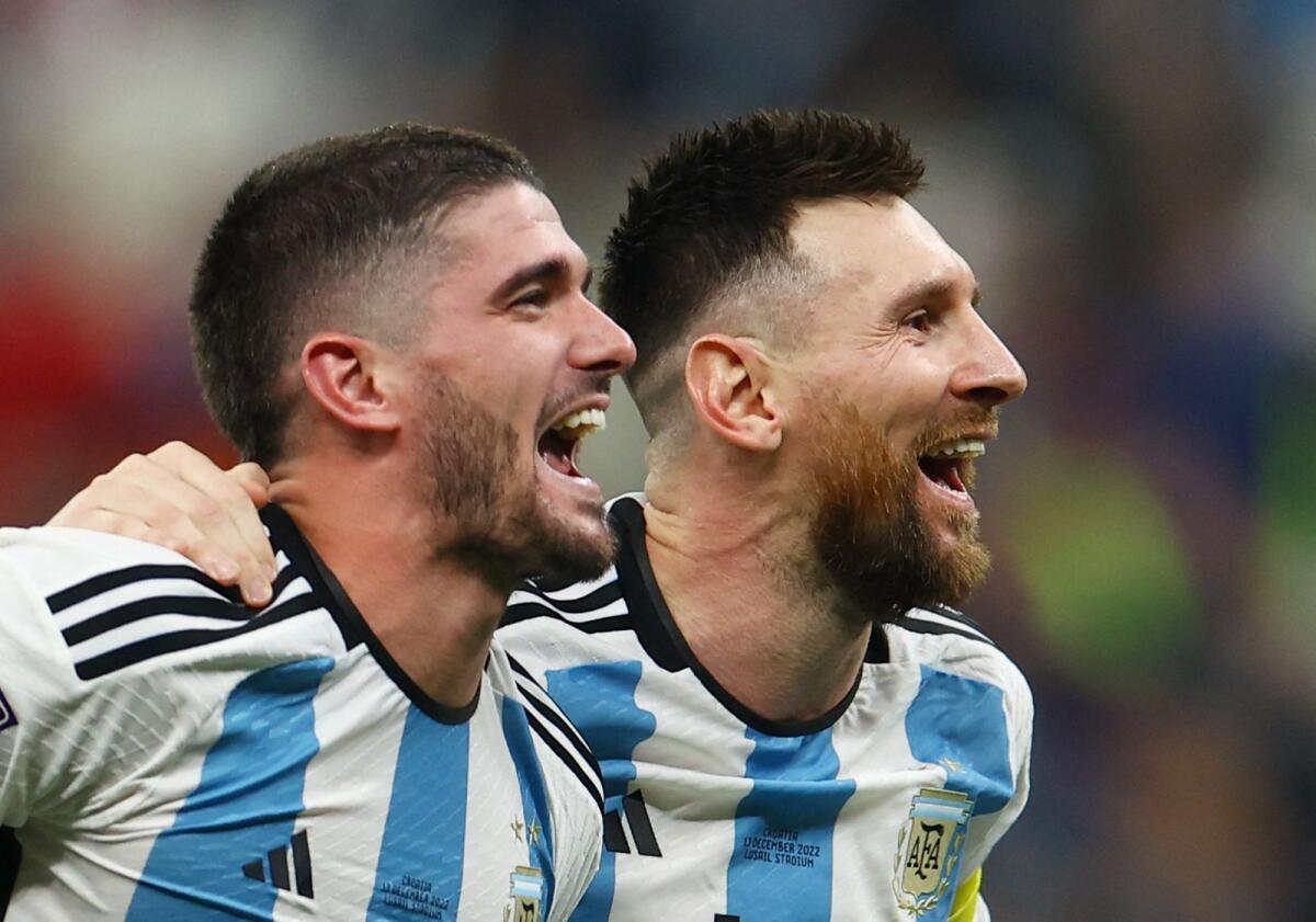 Lionel Messi celebrates with Rodrigo De Paul.