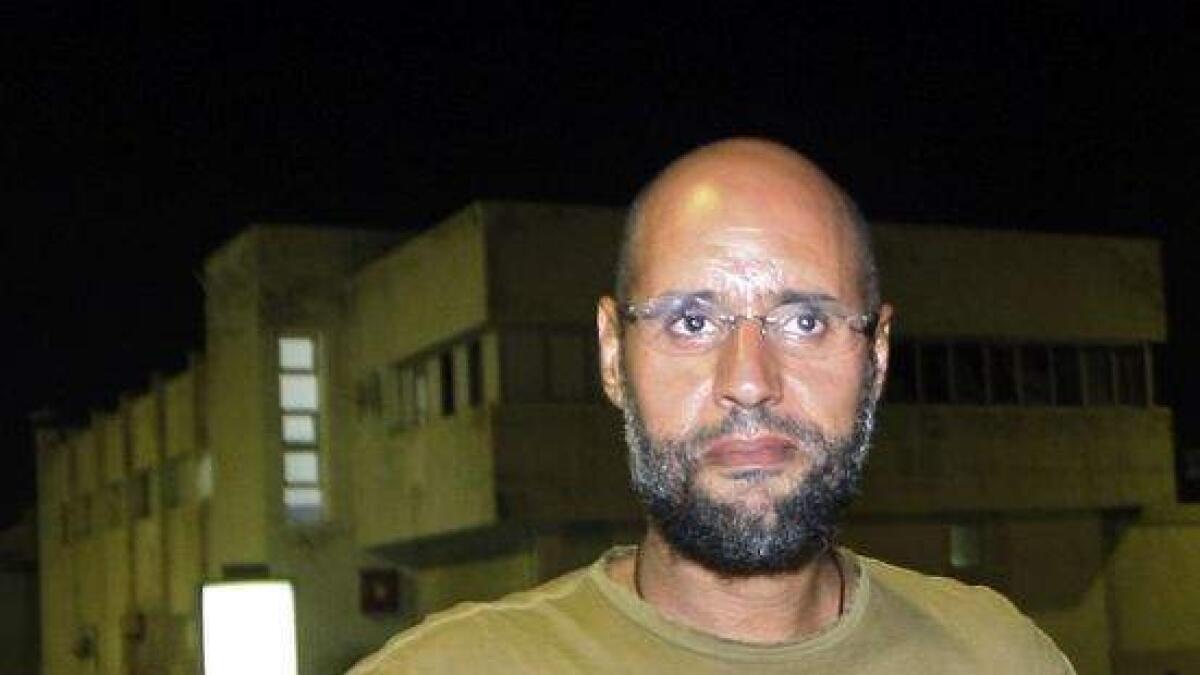 Libya court sentences Gaddafis son, eight aides to death