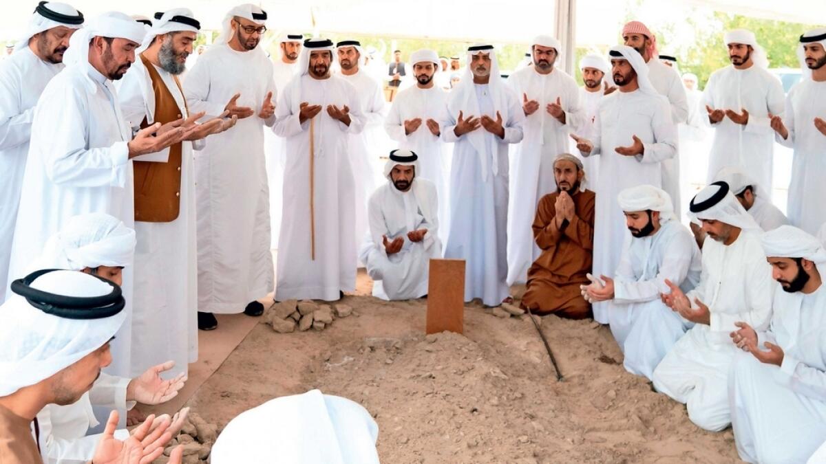 TEARY FAREWELL: Sheikh Mohamed bin Zayed, other Sheikhs from Al Nahyan family and Emiratis pray during the burial of Sheikh Sultan bin Zayed Al Nahyan at Al Bateen on Wednesday. - Wam