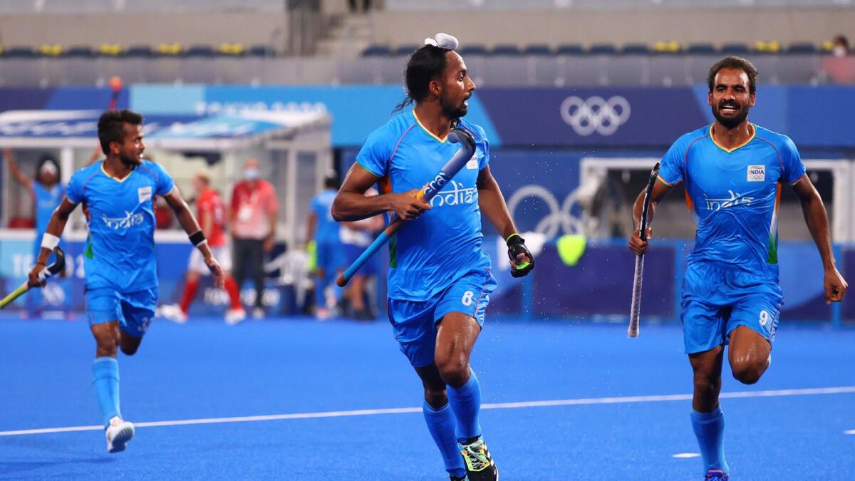 Hardik Singh of India celebrates with teammates after scoring a goal against Great Britain. (Reuters)