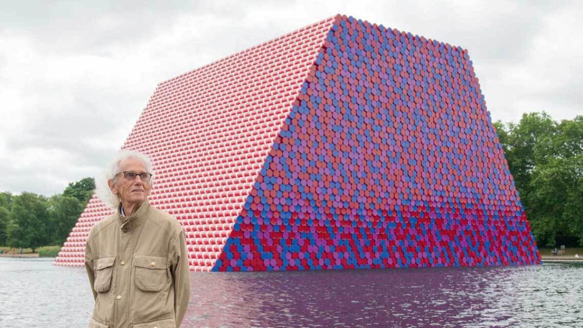 Christo attends the unveiling of his first UK outdoor exhibit, The London Mastaba, on the Serpentine Lake in Hyde Park, London.— AP