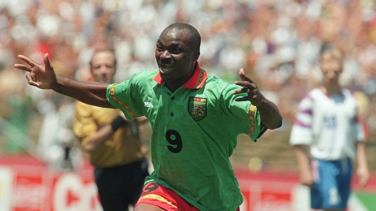 Roger Milla celebrates after scoring a goal against Russia in 1994 at Stanford stadium in San Francisco during their World Cup match. - AFP file