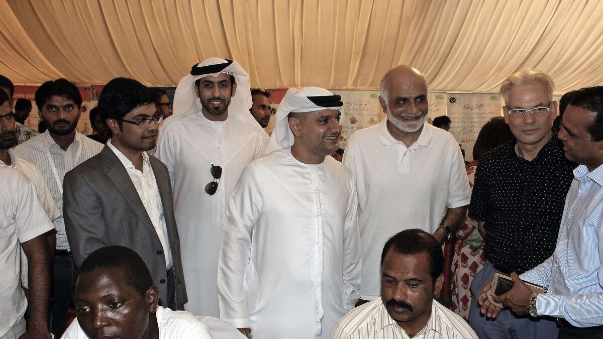Dr. Omar Al Muthanna, CEO Community Development Authority, at a labour camp organised by the Medical Wing.