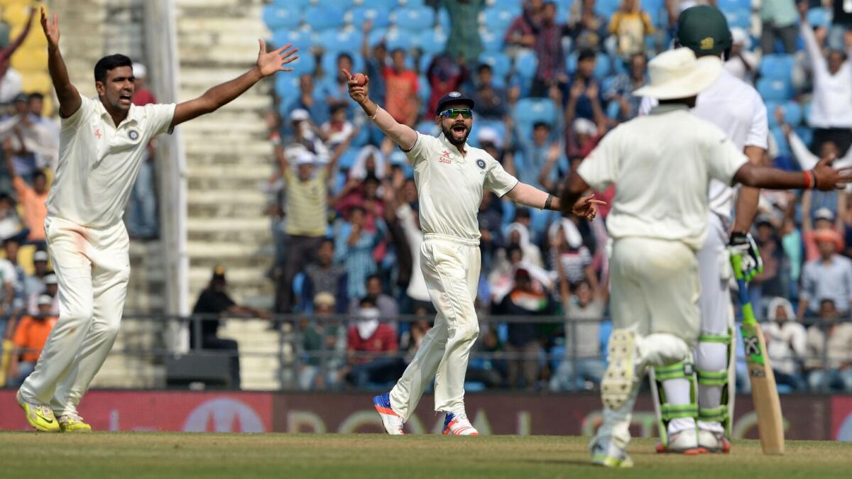 Ravichandran Ashwin (left), Virat Kohli (centre) appeal for a catch against Hashim Amla during the third day of the third Test. 