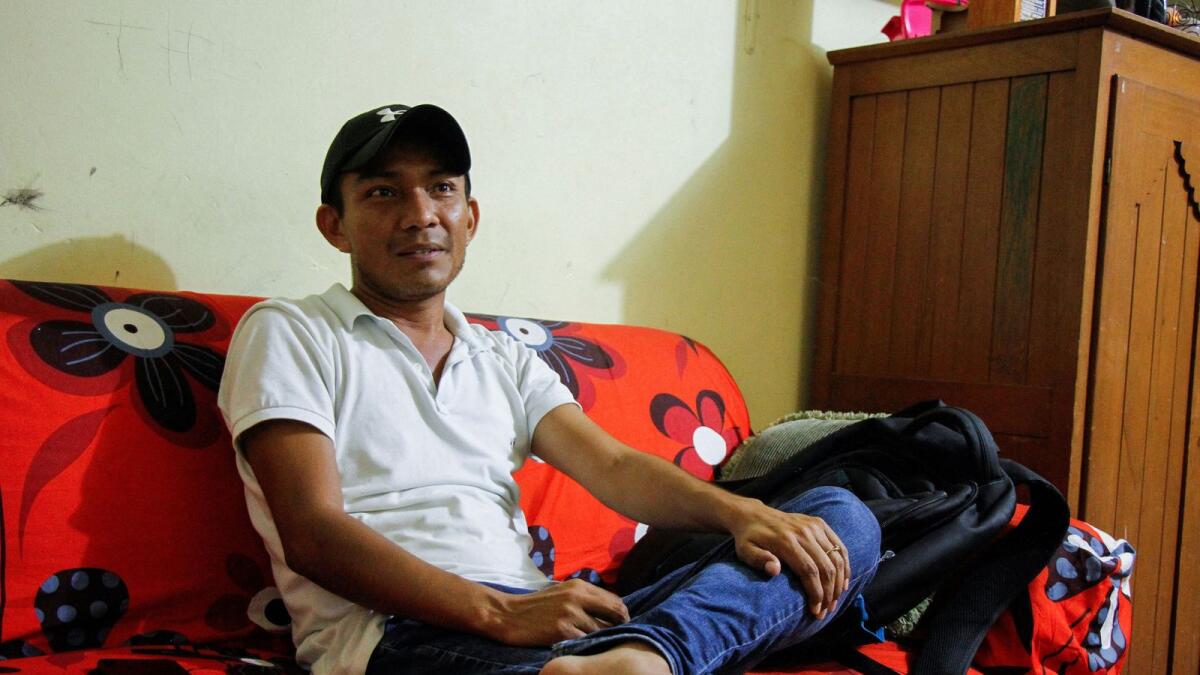 Irving Lopez, brother of late journalist Heber Lopez, who was killed by assailants while arriving to his home. — Reuters