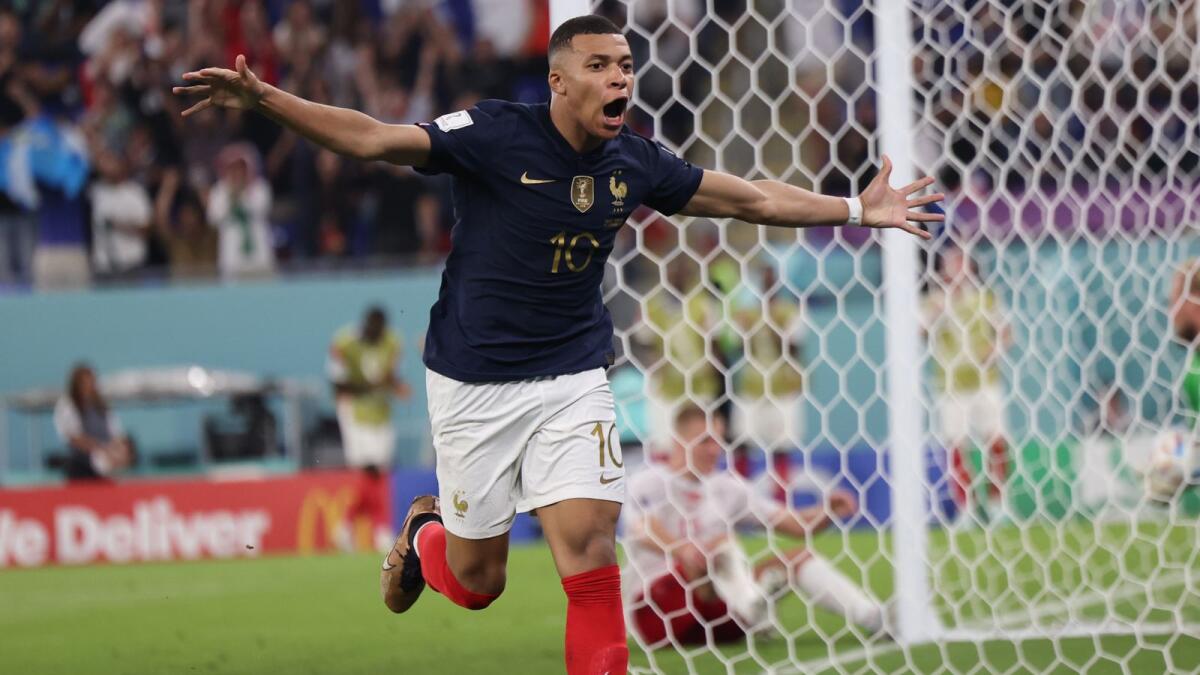 France's forward Kylian Mbappe celebrates scoring his team's second goal during the match with Denmark in Doha. –AFP