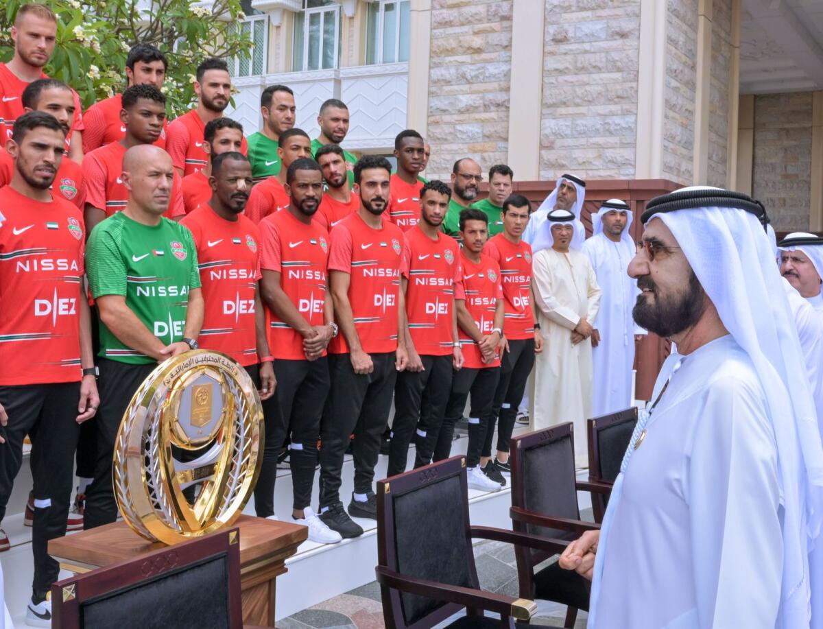 Sheikh Mohammed greets the players and officials of Shabab AlAhli Dubai Football Club on Monday. — Courtesy: Twitter