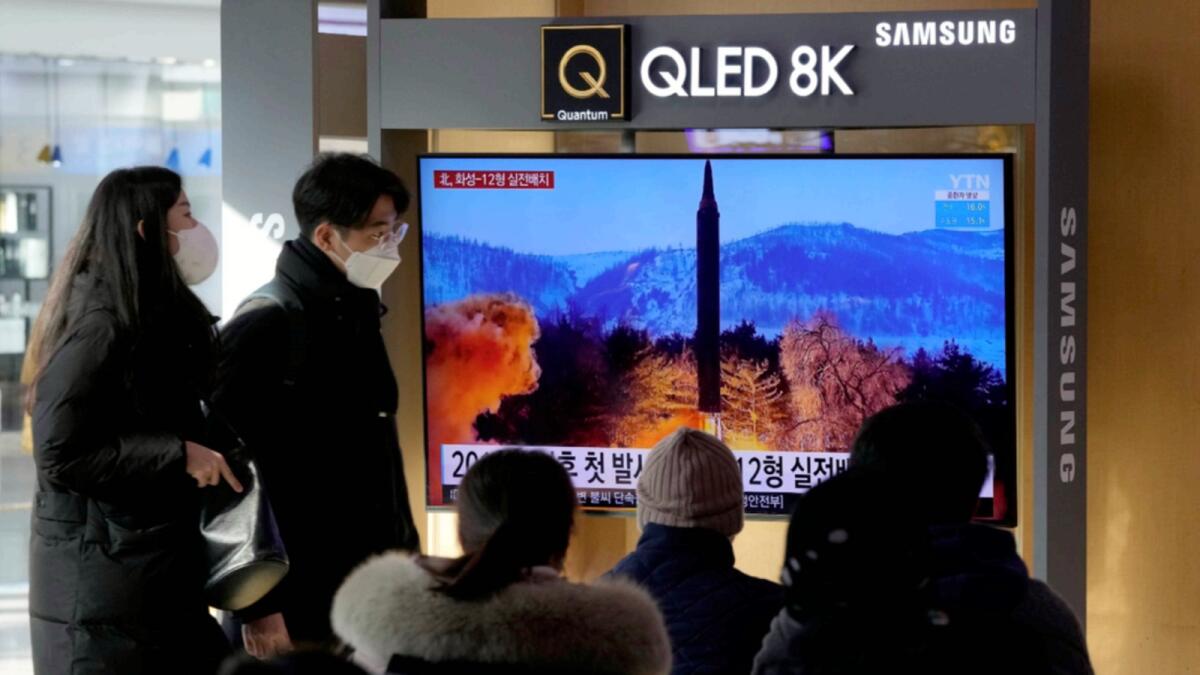 People watch a TV showing an image of North Korea's missile launch during a news program at the Seoul Railway Station. — AP