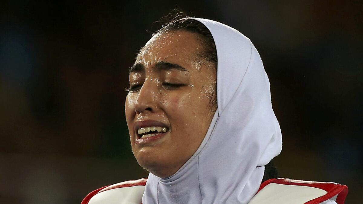 Kimia Alizadeh Zenoorin of Iran reacts after losing the women's 57kg taekwondo quarterfinal. Reuters