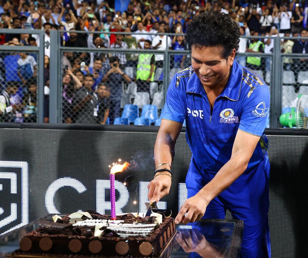 Sachin Tendulkar cuts the birthday cake to celebrate the most memorable half-century of his life. — Twitter