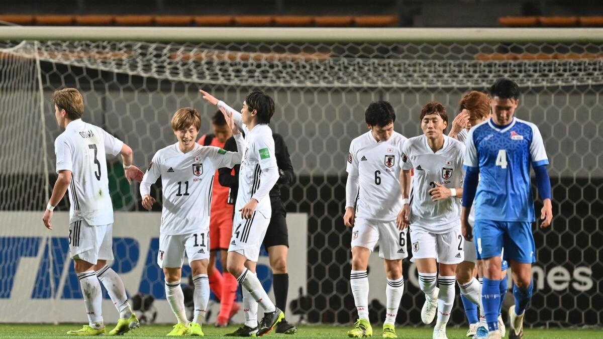 Japan's Kyogo Furuhashi is congratulated after scoring a goal against Mongolia. (AFP)