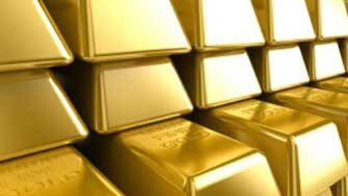 Gold nudges at two-week highs as dollar retreats