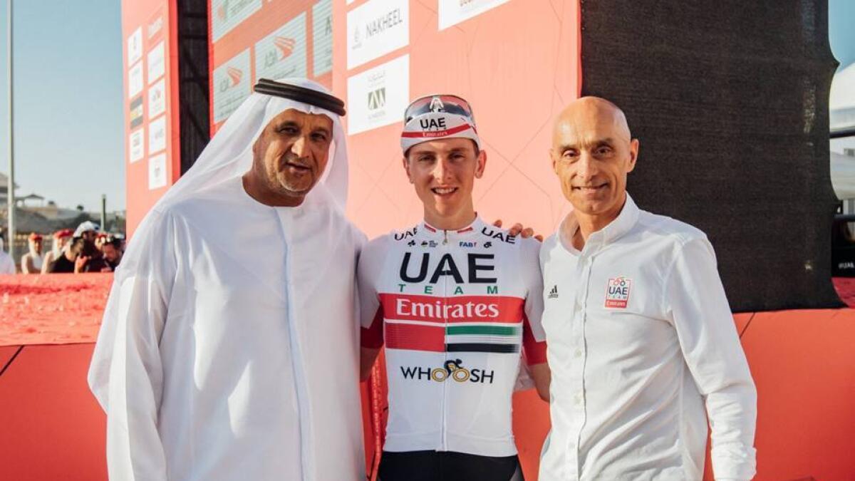 Tadej Pogacar (centre) will stay with the UAE team until the end of the 2024 season (Supplied photo)