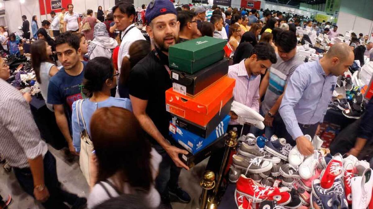 Residents grab branded products at throwaway prices during The Big Clearance Sale at the Dubai World Trade Centre on Thursday. The event will be on from 10am to 8pm today.